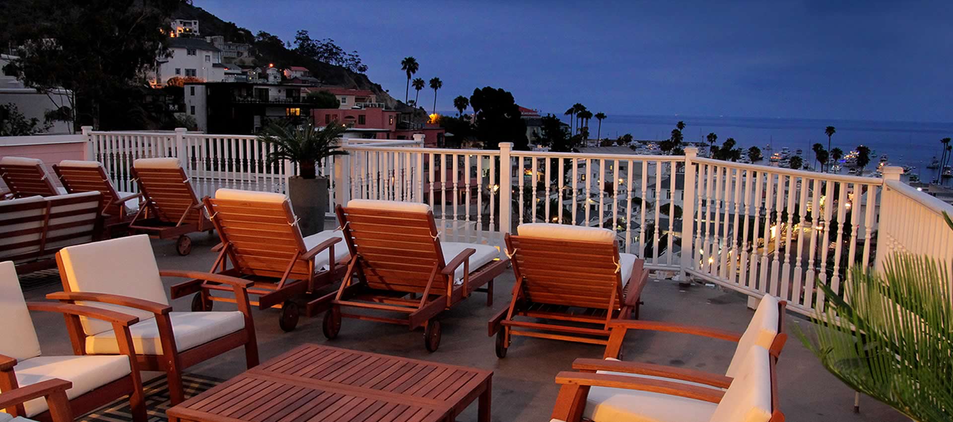 View of Avalon harbor at sunset from large patio balcony