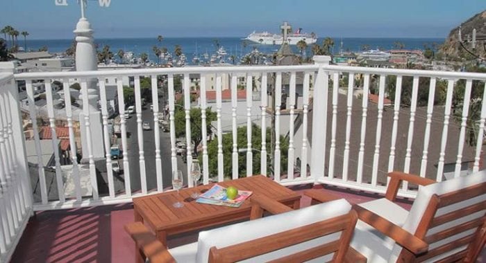Room 7JB - King Bed Balcony with chairs and harbor view
